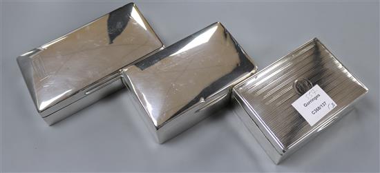 Three assorted silver cigarette boxes, largest 16.3cm.